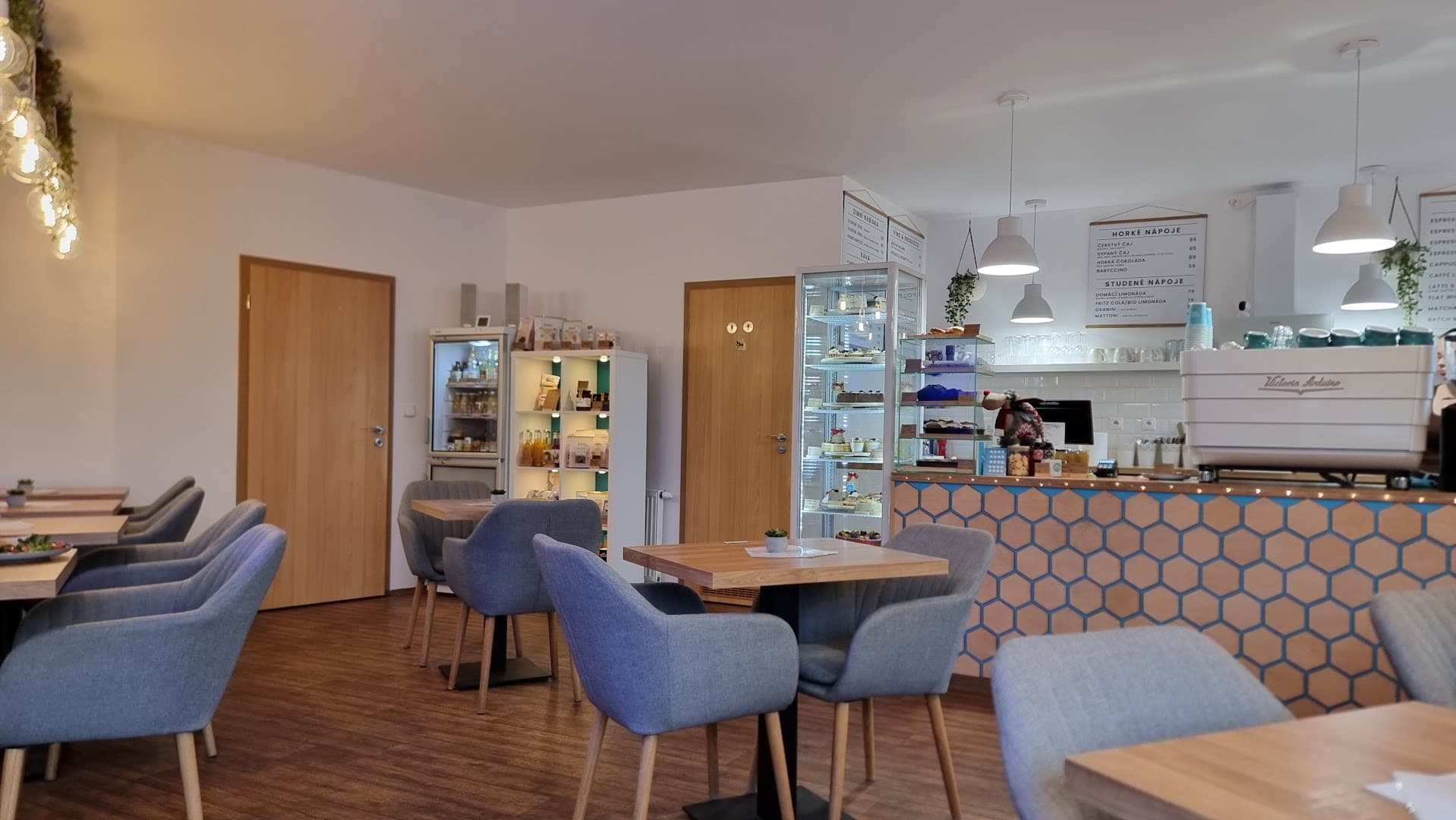 Interior of Helen's coffee Harmonická, specialty coffee shop in Prague
