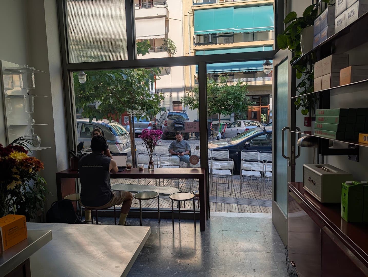 Interior of Kross Coffee Roasters Pagkrati, specialty coffee shop in Athens