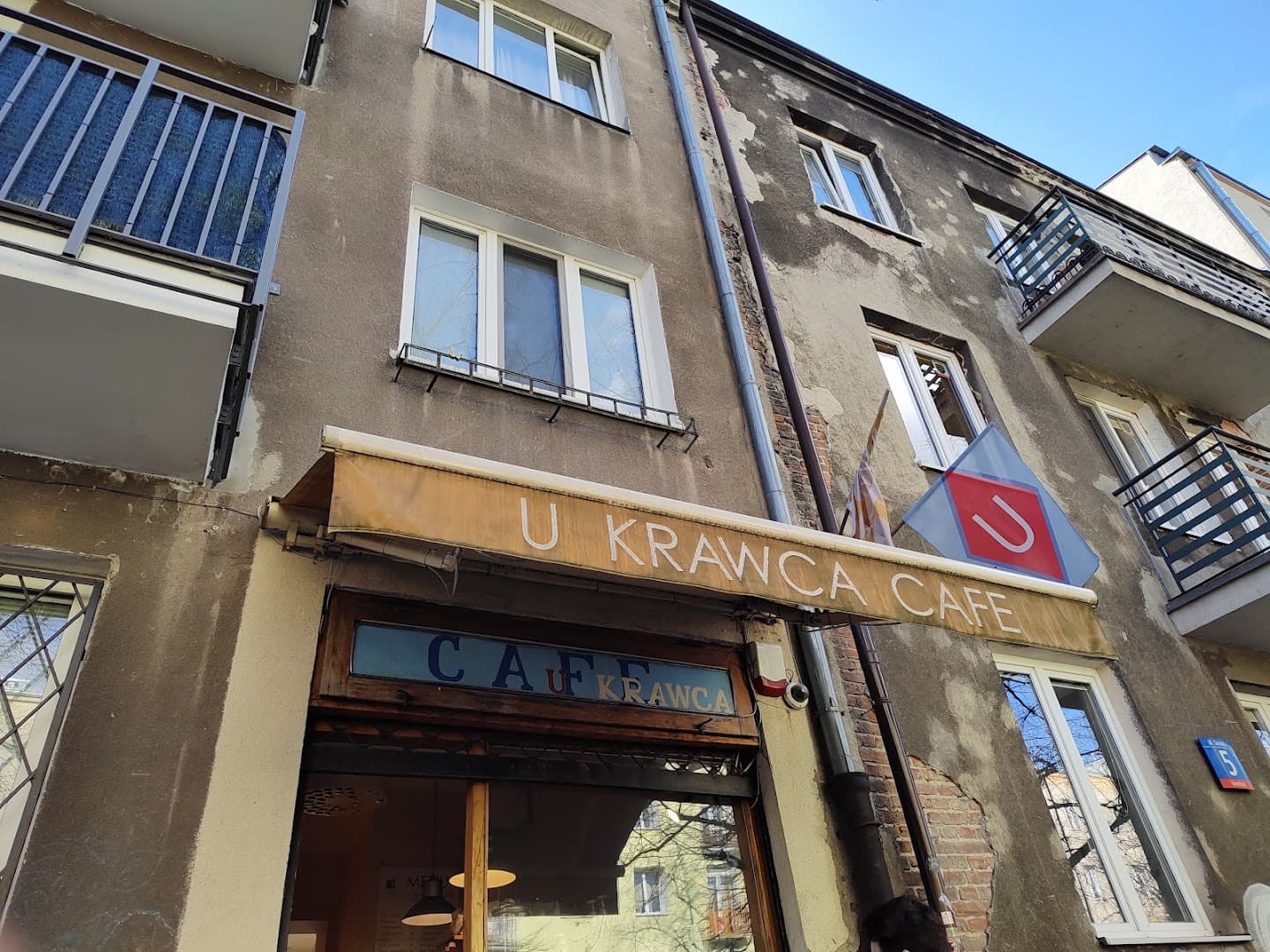 Storefront of U Krawca Café, specialty coffee shop in Warsaw