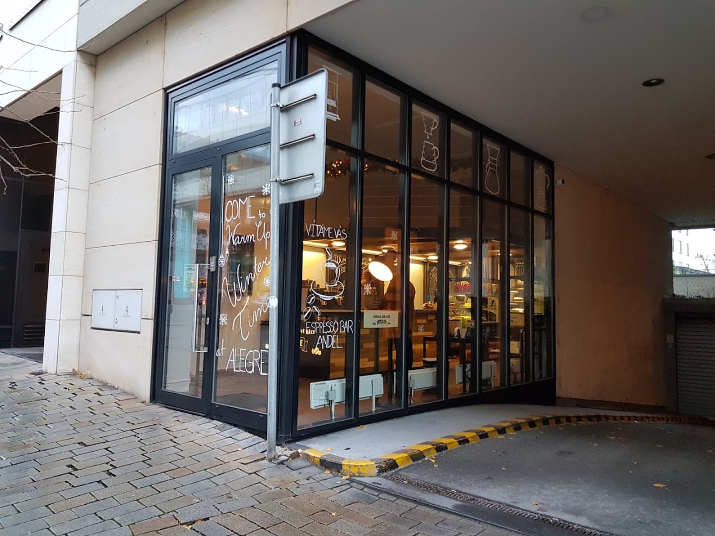 Storefront of Café Alegre, specialty coffee shop in Prague