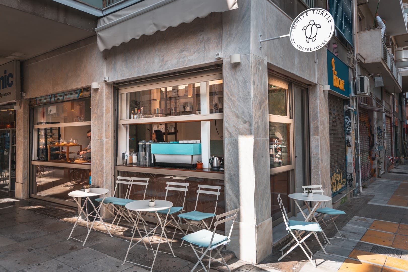 Storefront of White Turtle Coffeehouse, specialty coffee shop in Athens