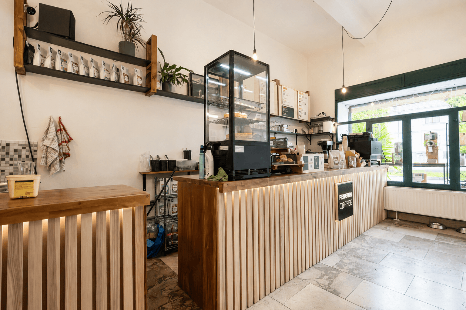 Interior of Penguin Coffee Strašnice, specialty coffee shop in Prague