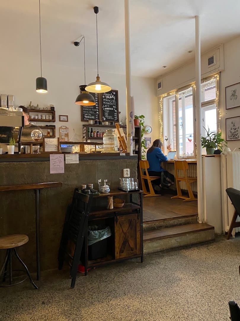 Interior of Café Tout va bien, specialty coffee shop in Prague