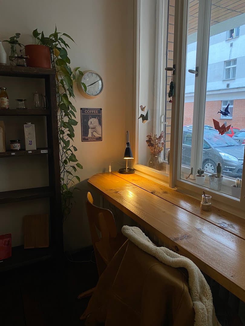 Interior of Café Tout va bien, specialty coffee shop in Prague