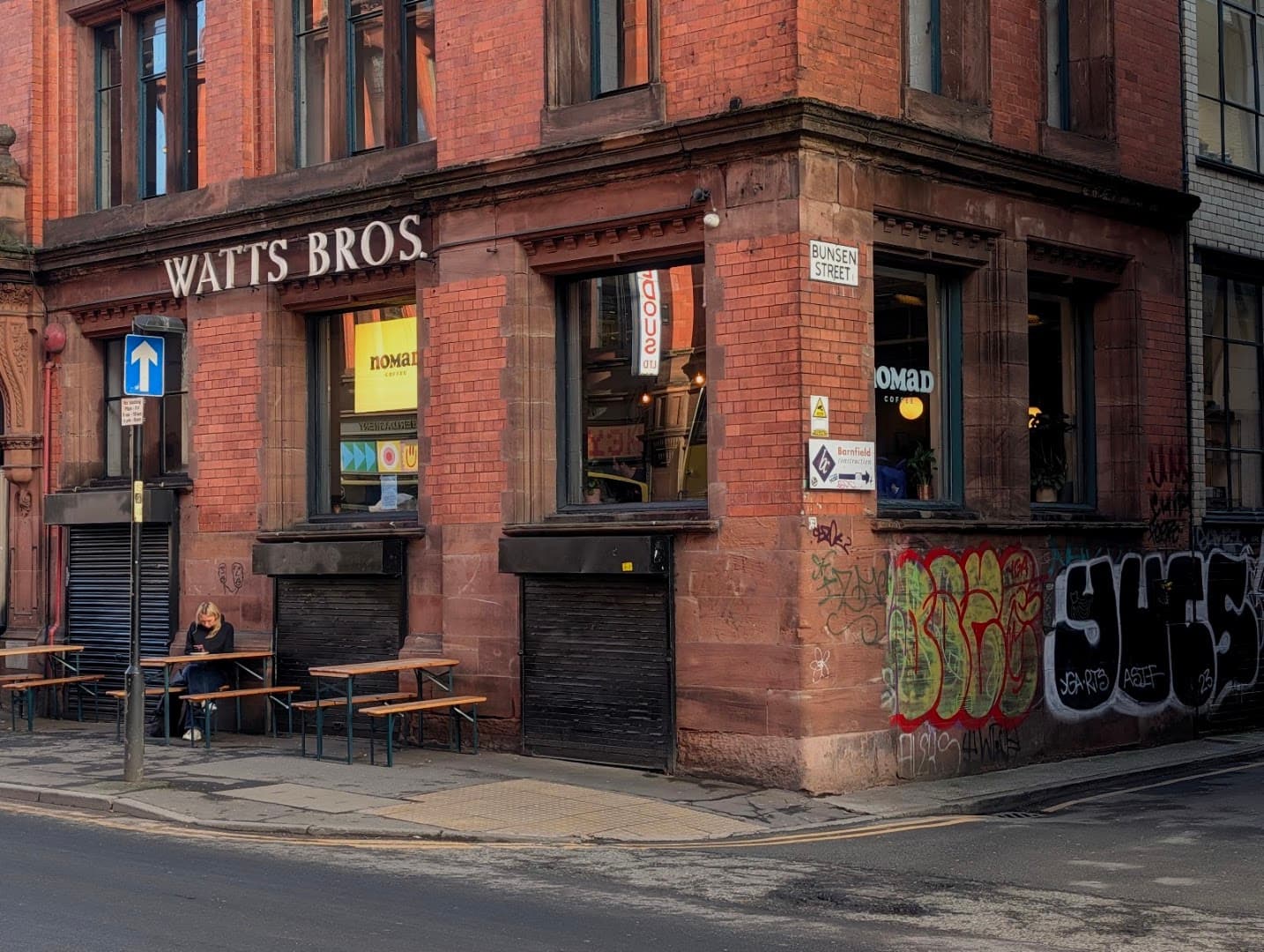 Storefront of Nomad Coffee, specialty coffee shop in Manchester