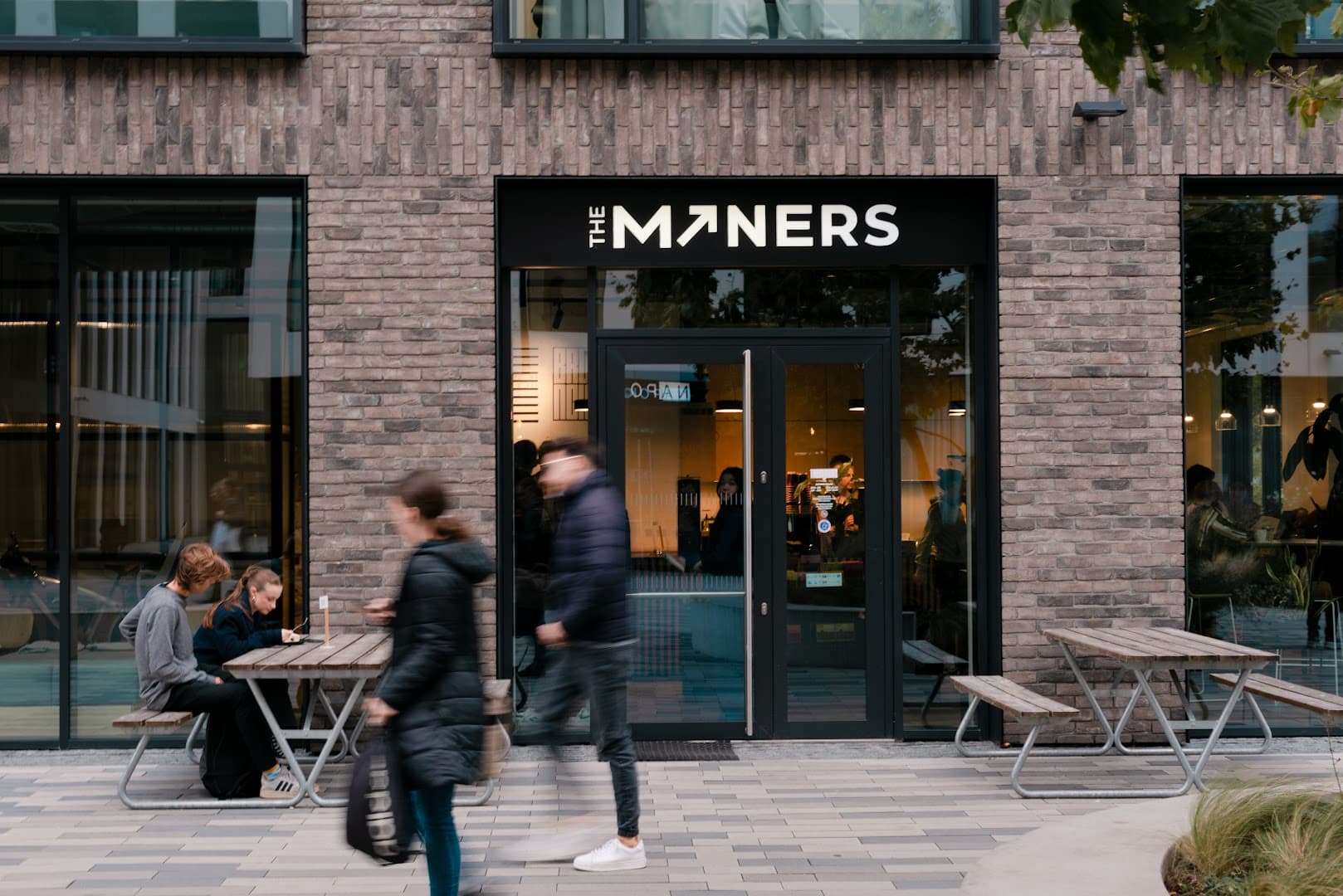 Storefront of The Miners Coffee Churchill, specialty coffee shop in Prague