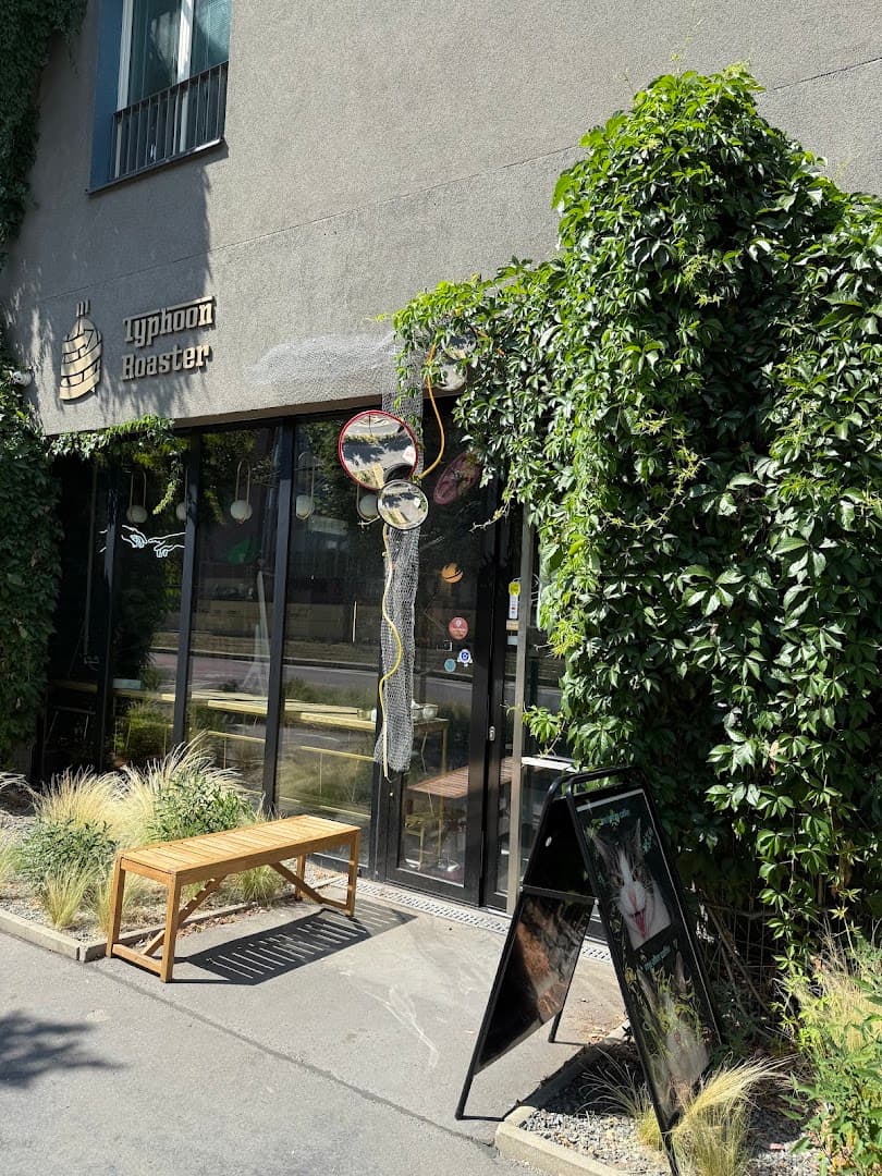 Storefront of Typhoon Coffee, specialty coffee shop in Prague