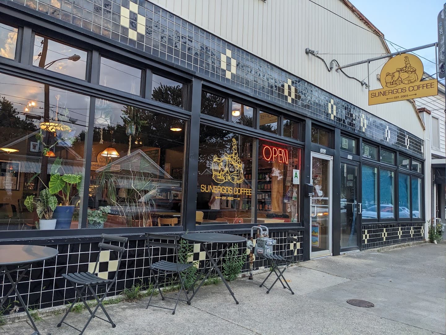 Storefront of Sunergos Coffee, specialty coffee shop in Louisville