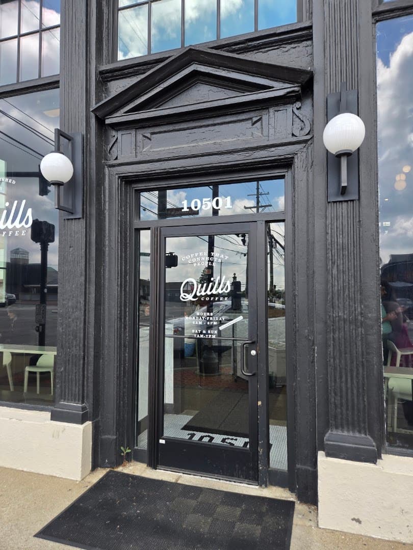 Storefront of Quills Coffee, specialty coffee shop in Louisville