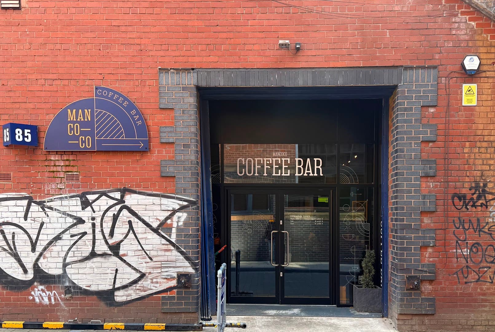 Storefront of Mancoco Coffee Bar, Roastery & Barista Training School, specialty coffee shop in Manchester
