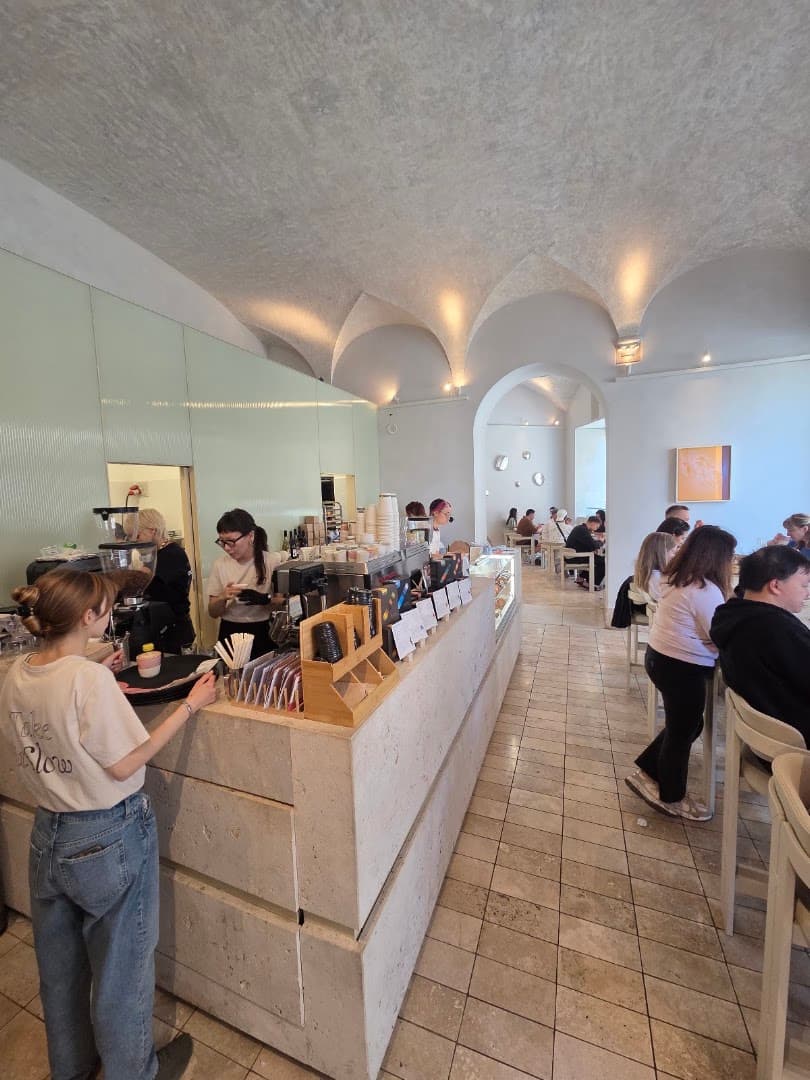 Interior of Slow - Specialty Coffee & Pastry Lab, specialty coffee shop in Rome