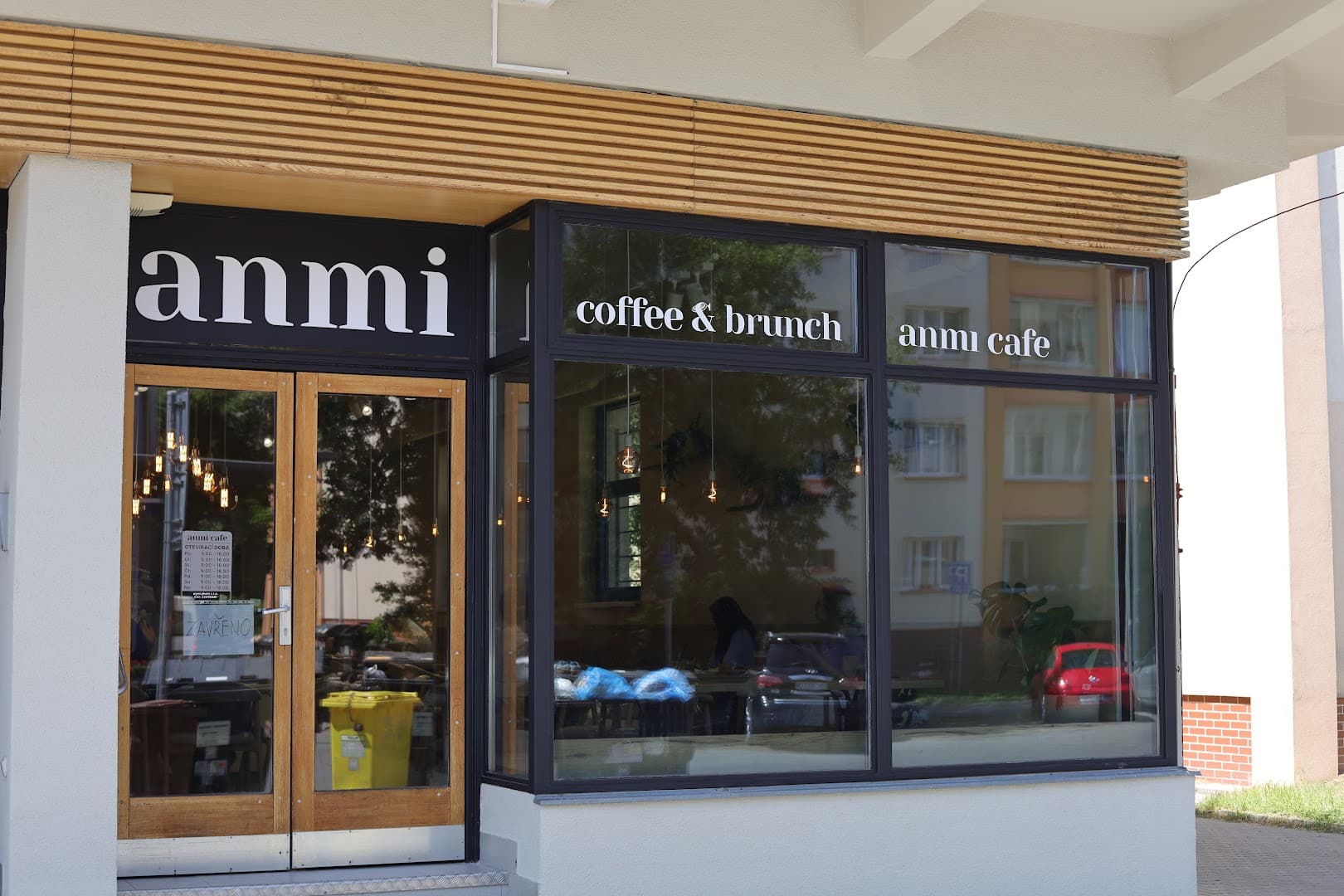 Storefront of anmi cafe, specialty coffee shop in Prague