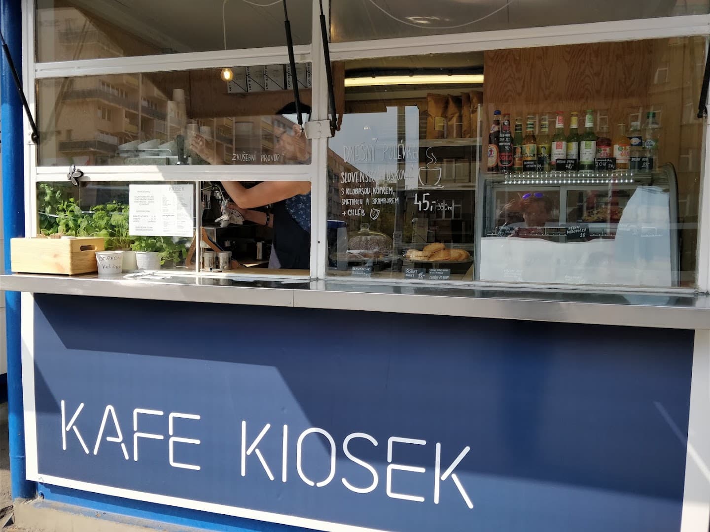 Storefront of Kiosek Dejvice, specialty coffee shop in Prague