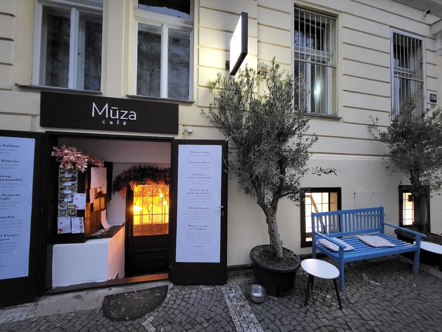 Storefront of Múza Café, specialty coffee shop in Prague