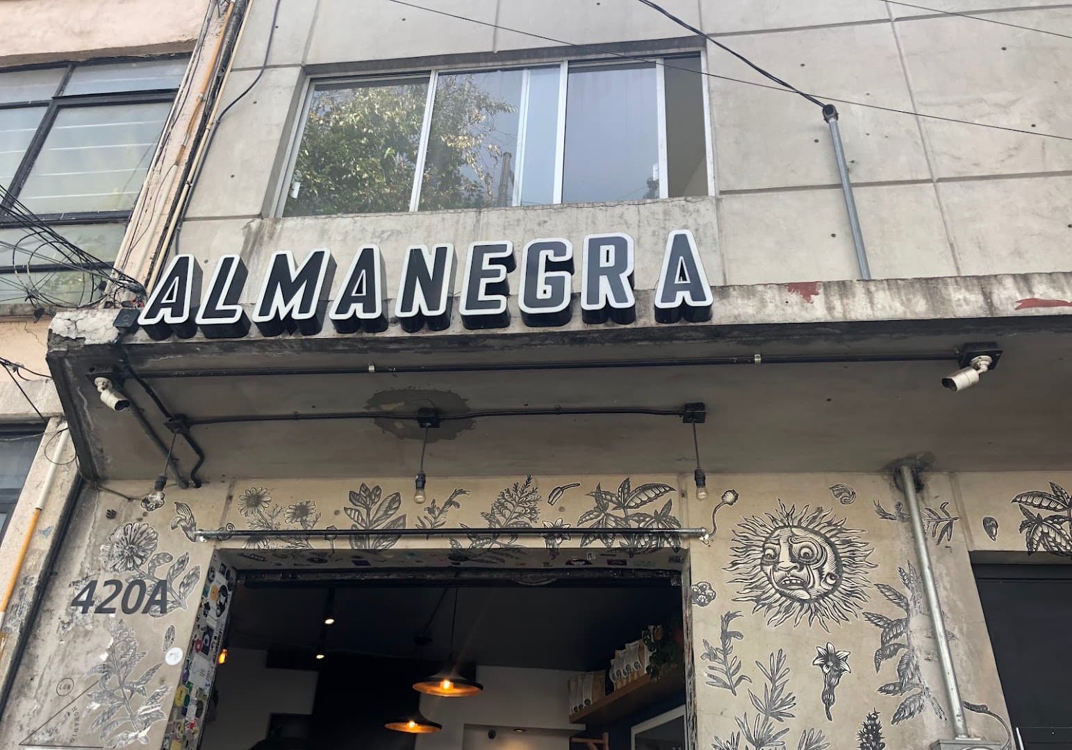 Storefront of Almanegra Café, specialty coffee shop in Mexico City