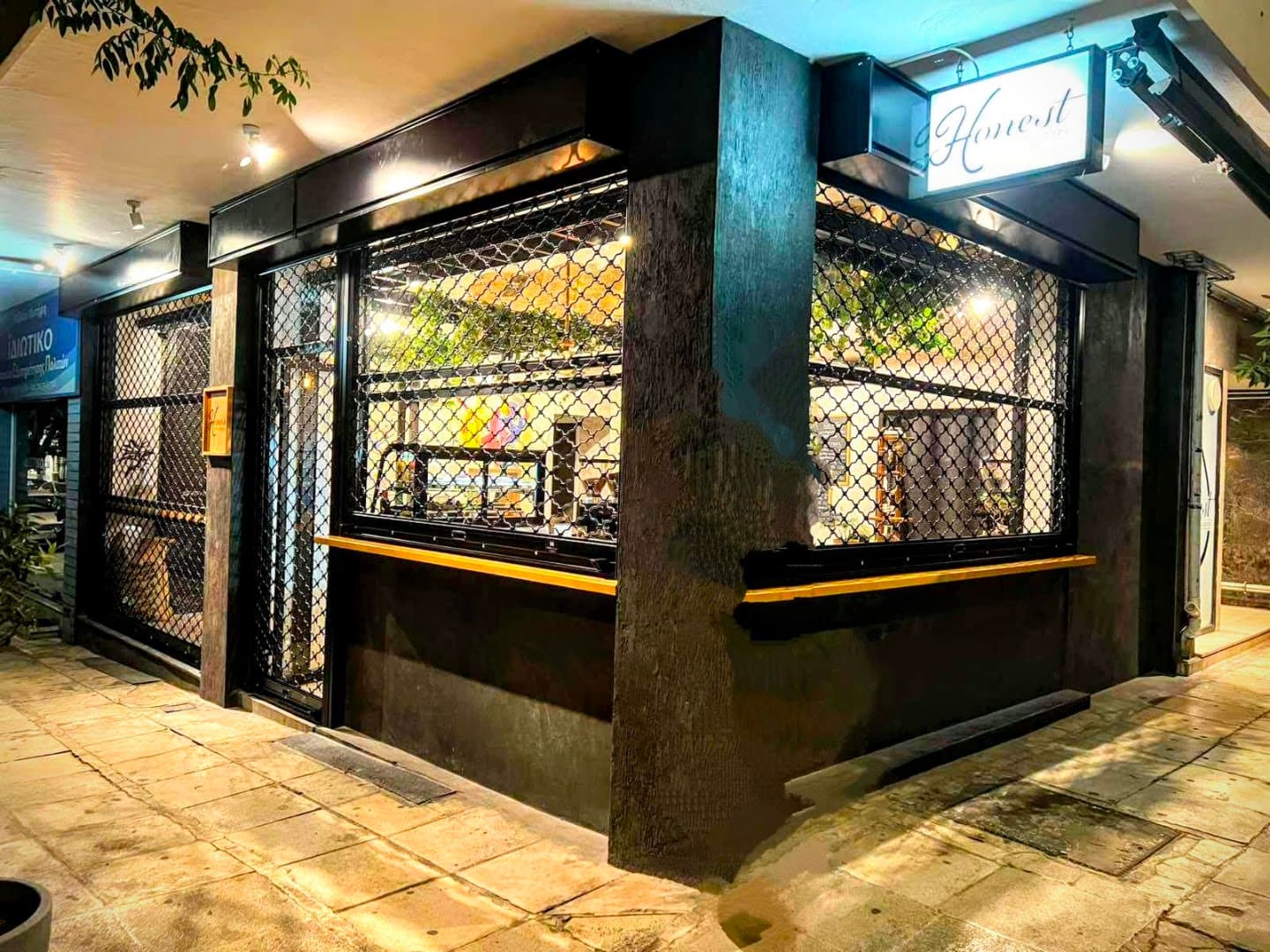 Storefront of Honest Coffee Developers, specialty coffee shop in Athens