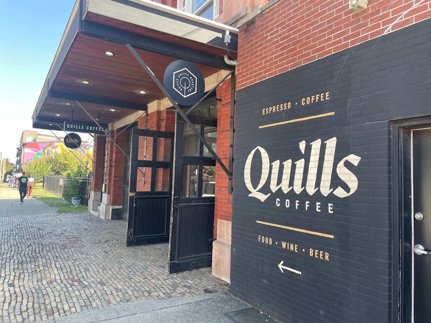 Storefront of Quills Coffee, specialty coffee shop in Louisville