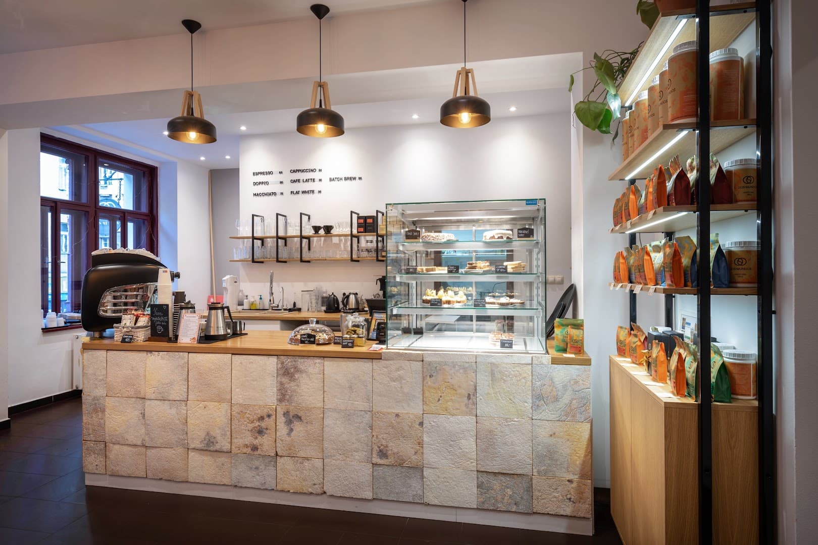 Interior of Dos Mundos Coffee Roastery, specialty coffee shop in Prague