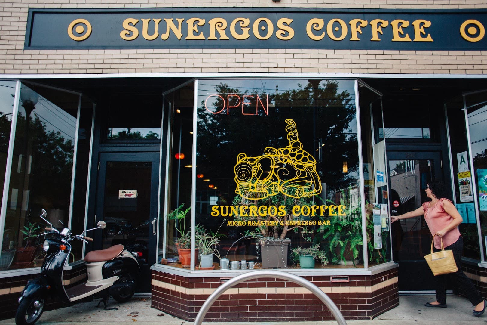 Storefront of Sunergos Coffee, specialty coffee shop in Louisville