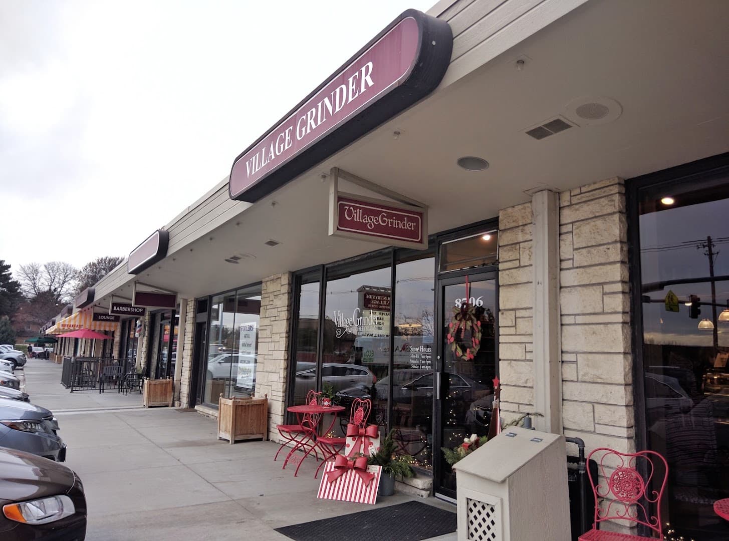 Storefront of Village Grinder, specialty coffee shop in Omaha