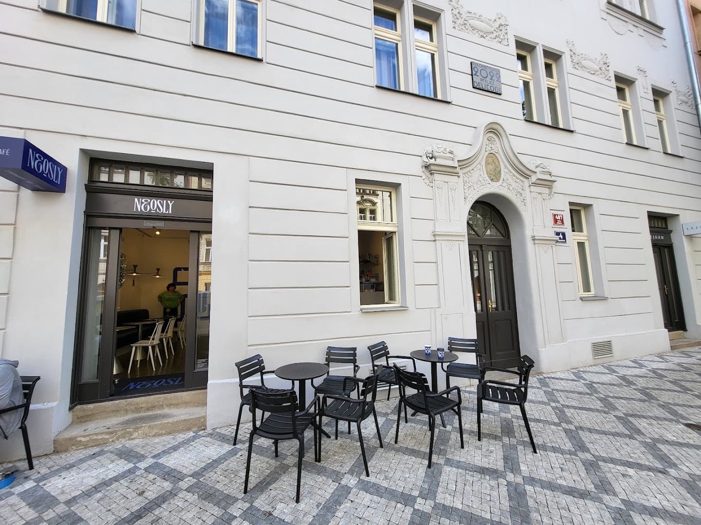 Storefront of Neosly, specialty coffee shop in Prague