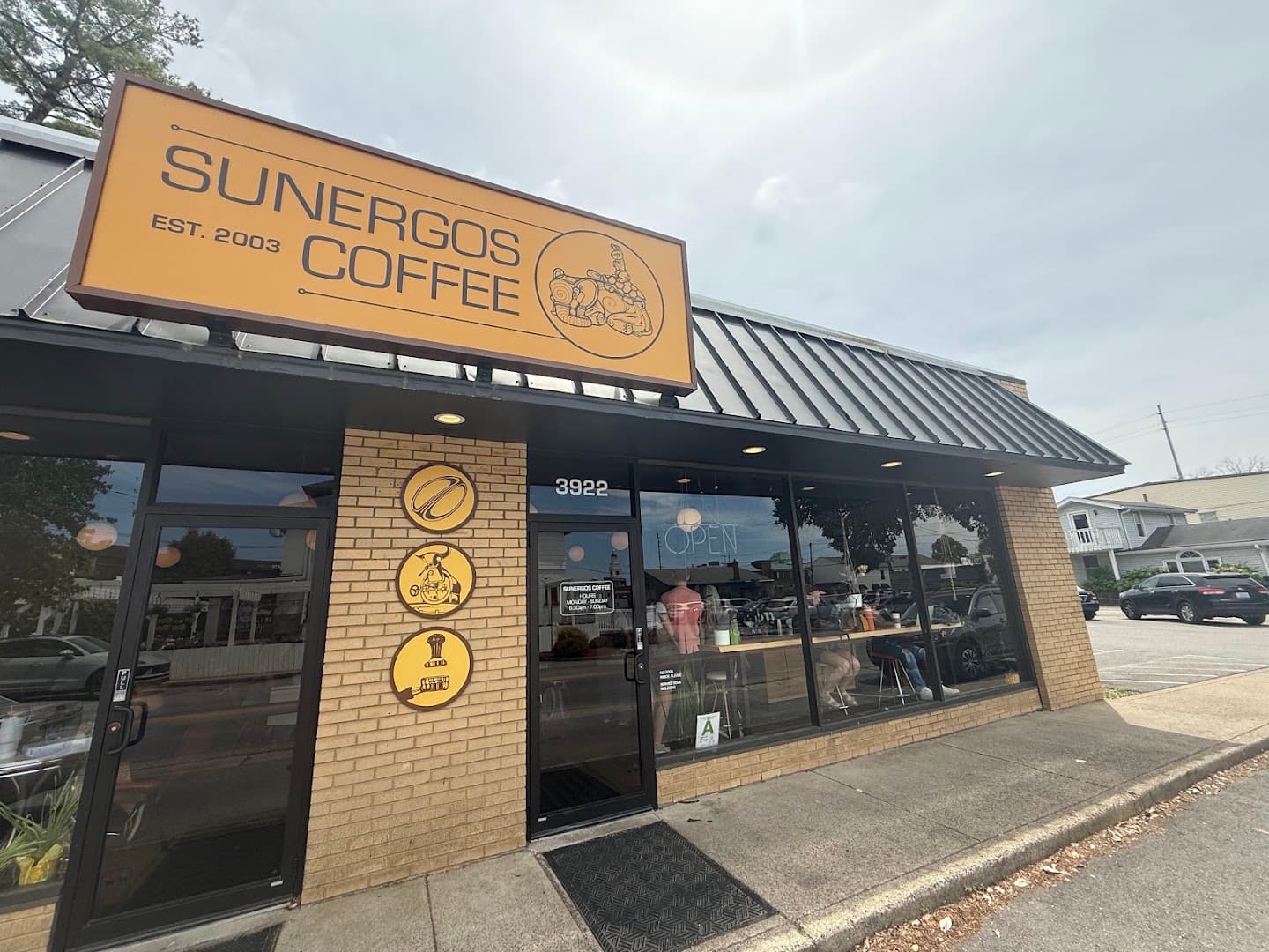 Storefront of Sunergos Coffee, specialty coffee shop in Louisville
